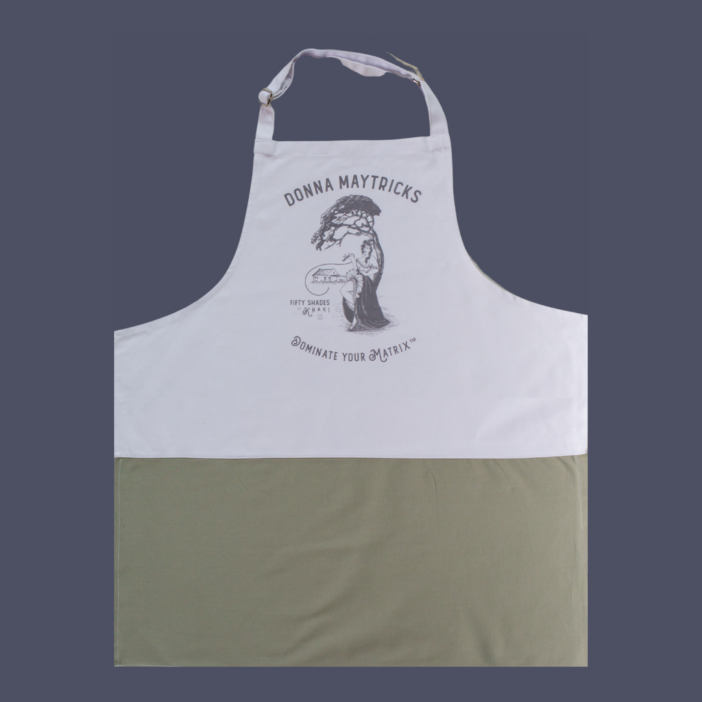 This quality apron is the perfect gift. The black and white print is beautifully designed and unique with a vintage ‘Boere-Burlesque-flair’. The product taglines are witty and on this apron it is Donna Maytrix Dominate Your Matrix. The one-size-fits-all apron panel is 70cm in width, has long tie-back bands to wrap around the skinny or full-bodied alike.