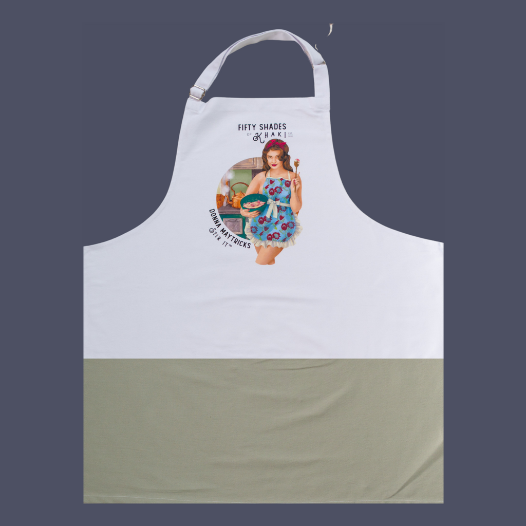 This quality apron is the perfect gift. The color print is beautifully designed and unique with a vintage ‘Boere-Burlesque-flair’. The product taglines are witty and on this apron it is Stir It.. The one-size-fits-all apron panel is 70cm in width, has long tie-back bands to wrap around the skinny or full-bodied alike. 2-tone white and khaki chic and adjustable clasp for neck.